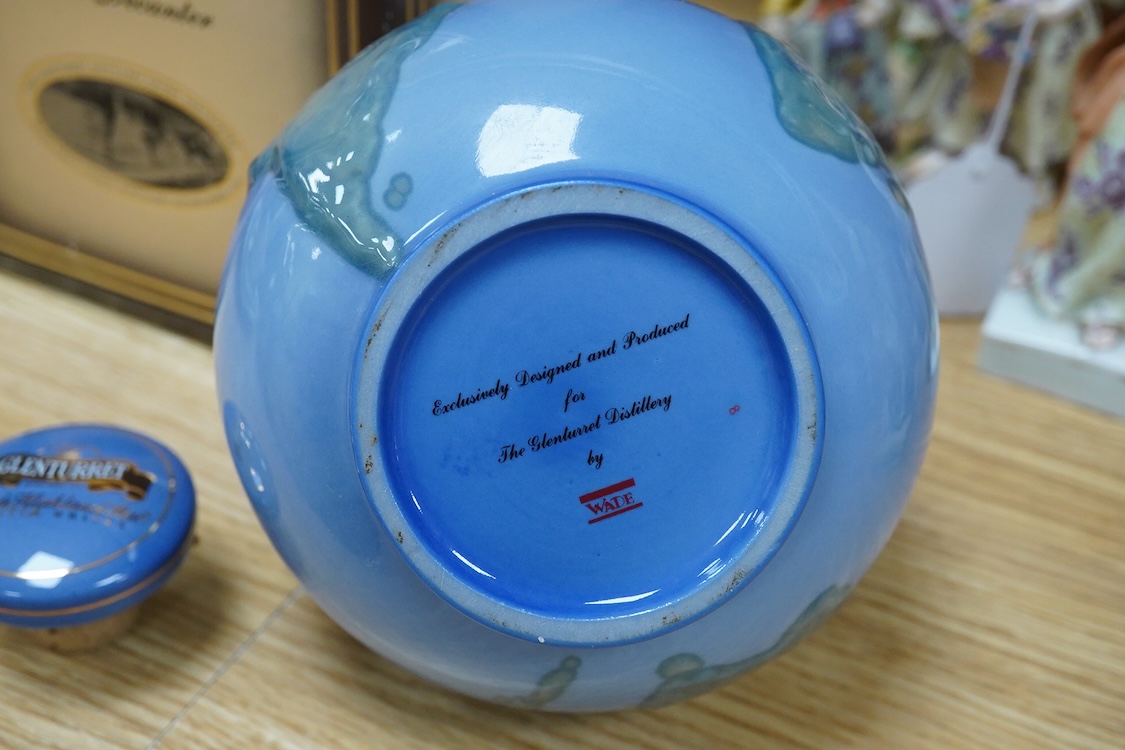 A boxed bottle of Glenturret single highland malt whisky, housed in a globe decanter